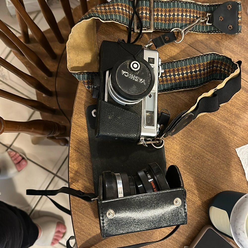 Old camera bundle with two extra lenses and awesome cases to carry around neck